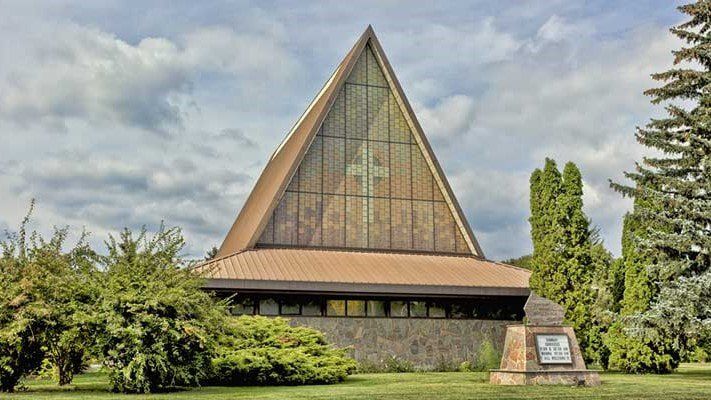 Harcourt Memorial United Church, with its tall A-frame roof and patterned glass front